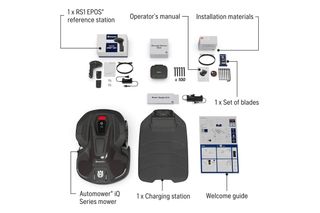 Top view of Husqvarna Automower iQ Series mower with charging station, blades, and installation materials.
