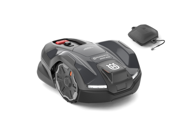 Side view of a Husqvarna robotic lawn mower with its charging station.