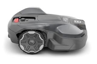 Side view of a Husqvarna robotic lawn mower with visible control panel and wheels.