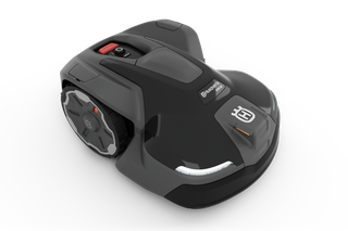 Side view of a Husqvarna robotic lawn mower on a white background.