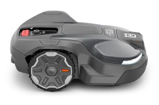 Side view of a Husqvarna robotic lawn mower with visible control panel and wheels.
