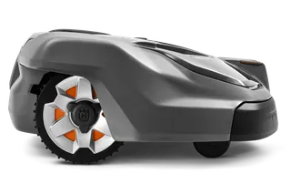 Side view of a Husqvarna robotic lawn mower showcasing its wheel design.