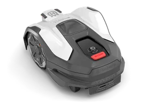 Robotic lawn mower with visible control panel and wheels, showcasing its compact design.
