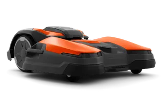 Side view of a Husqvarna robotic lawn mower designed for efficient garden maintenance.