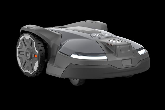 Vue latérale d’un robot tondeuse équipé de voyants LED.