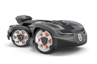 Side view of a Husqvarna robotic lawn mower with visible wheels and logo.