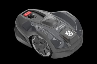 Side view of a Husqvarna robotic lawn mower with visible control panel.