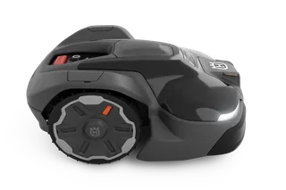 Side view of a Husqvarna robotic lawn mower with LED lights.