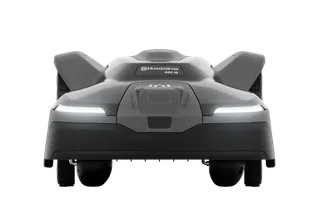 Front view of a Husqvarna robotic lawn mower model 450X with LED headlights.