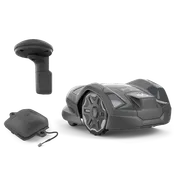 Husqvarna robotic lawn mower with a charging station and a protective cover, studio shot.