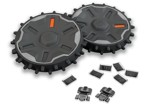 Top view of Husqvarna robotic lawn mower wheels and accessories, including brushes and clips.