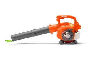Side view of a Husqvarna leaf blower with visible engine and nozzle.