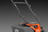 Rear view of a Husqvarna lawn mower with a grass collection bag.