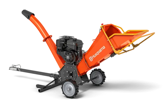 Husqvarna GC 5100PE. Side view of a garden chipper with a discharge chute and large wheels.