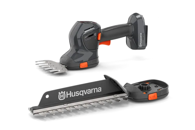 Vue de face d’un outil de jardinage portatif Husqvarna à lames interchangeables.