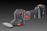Вигляд збоку на акумуляторні газонні ножиці Husqvarna з ергономічною ручкою й акумулятором ємністю 2,0 А·год.