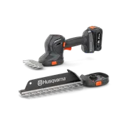Вигляд спереду акумуляторних газонних ножиць і кущоріза Husqvarna зі змінними лезами.