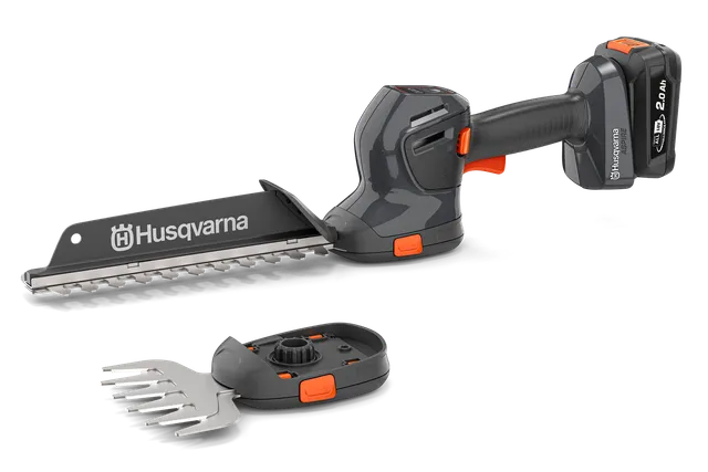 Вигляд збоку - акумуляторного тримера для живої огорожі Husqvarna зі змінними лезами.