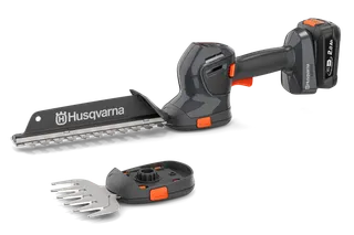 Вигляд збоку - акумуляторного тримера для живої огорожі Husqvarna зі змінними лезами.