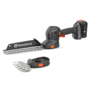 Вигляд збоку - акумуляторного тримера для живої огорожі Husqvarna зі змінними лезами.
