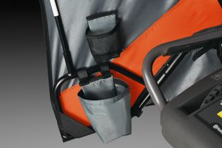 Close-up of a product with two storage pouches attached to a frame.