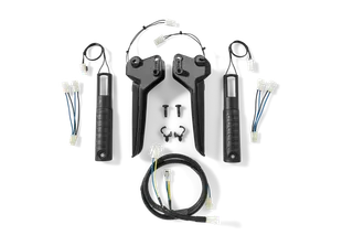 Top view of a set of black handles and wiring components, including connectors and screws.