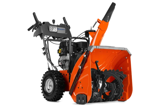 Zijaanzicht van een Husqvarna-sneeuwblazer met de vijzel en het bedieningspaneel.