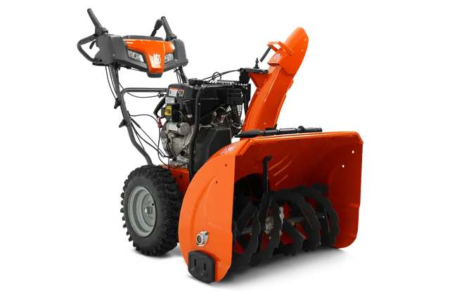 Vue latérale d’une souffleuse à neige Husqvarna mettant en valeur sa tarière et son panneau de commande.