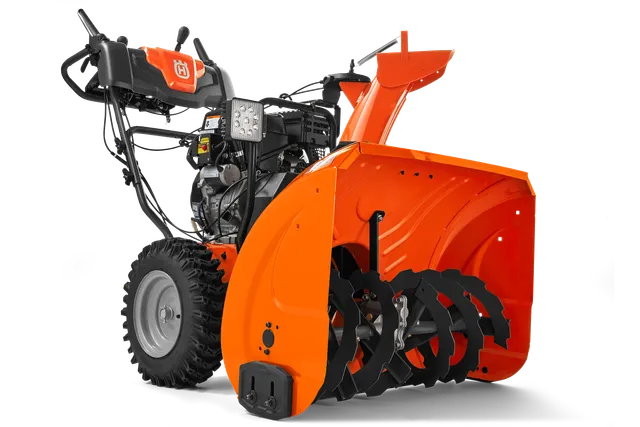 Вигляд снігоочисника Husqvarna збоку з видимими шнеком і панеллю керування.