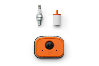 Top view of a spark plug, a fuel filter, and a Husqvarna product component.