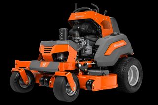 Side view of a Husqvarna commercial front mower with cutting deck.