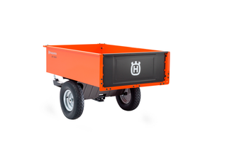 Vue latérale d’une remorque utilitaire Husqvarna avec logo sur le panneau arrière.