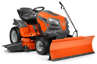 Front view of a Husqvarna ride-on mower equipped with a snow blade attachment.