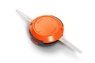 Top view of a Husqvarna trimmer head with visible string attachments.