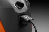 Close-up view of a power cable connected to a device with a dial control.