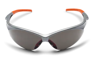 Front view of protective eyewear with tinted lenses and orange temple tips.