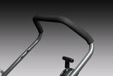 Close-up of a lawn mower handle and control lever.