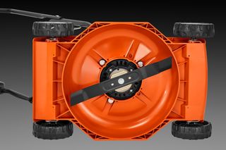 Top view of a lawn mower's cutting deck and blade.