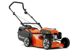 Side view of a Husqvarna lawn mower with visible engine and wheels.