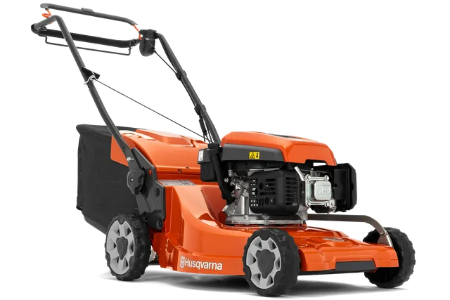 Side view of a Husqvarna lawn mower showcasing its engine and wheels.