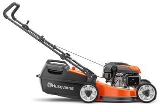Side view of a Husqvarna lawn mower with visible engine and grass catcher.
