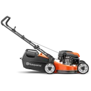 Side view of a Husqvarna lawn mower with visible engine and grass catcher.