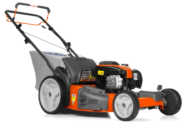 Side view of a lawn mower with visible engine and grass collection bag.