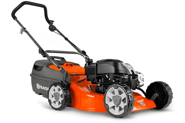 Side view of a Husqvarna lawn mower with a visible engine and handle.