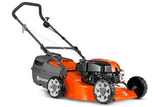 Side view of a Husqvarna lawn mower with visible engine and wheels.