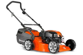 Side view of a Husqvarna lawn mower with visible engine and wheels.