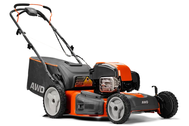 HUSQVARNA HU725AWDHQ. Side view of a Husqvarna AWD lawn mower showcasing its engine and grass collection bag.