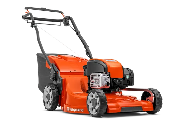 Side view of a Husqvarna lawn mower with visible engine and grass collection bag.