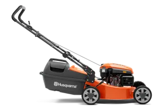 Side view of a Husqvarna lawn mower with grass collection bag.