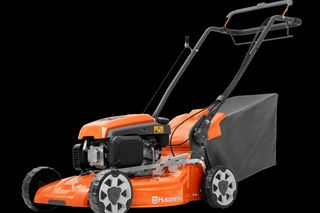 Side view of a Husqvarna lawn mower with grass collection bag.